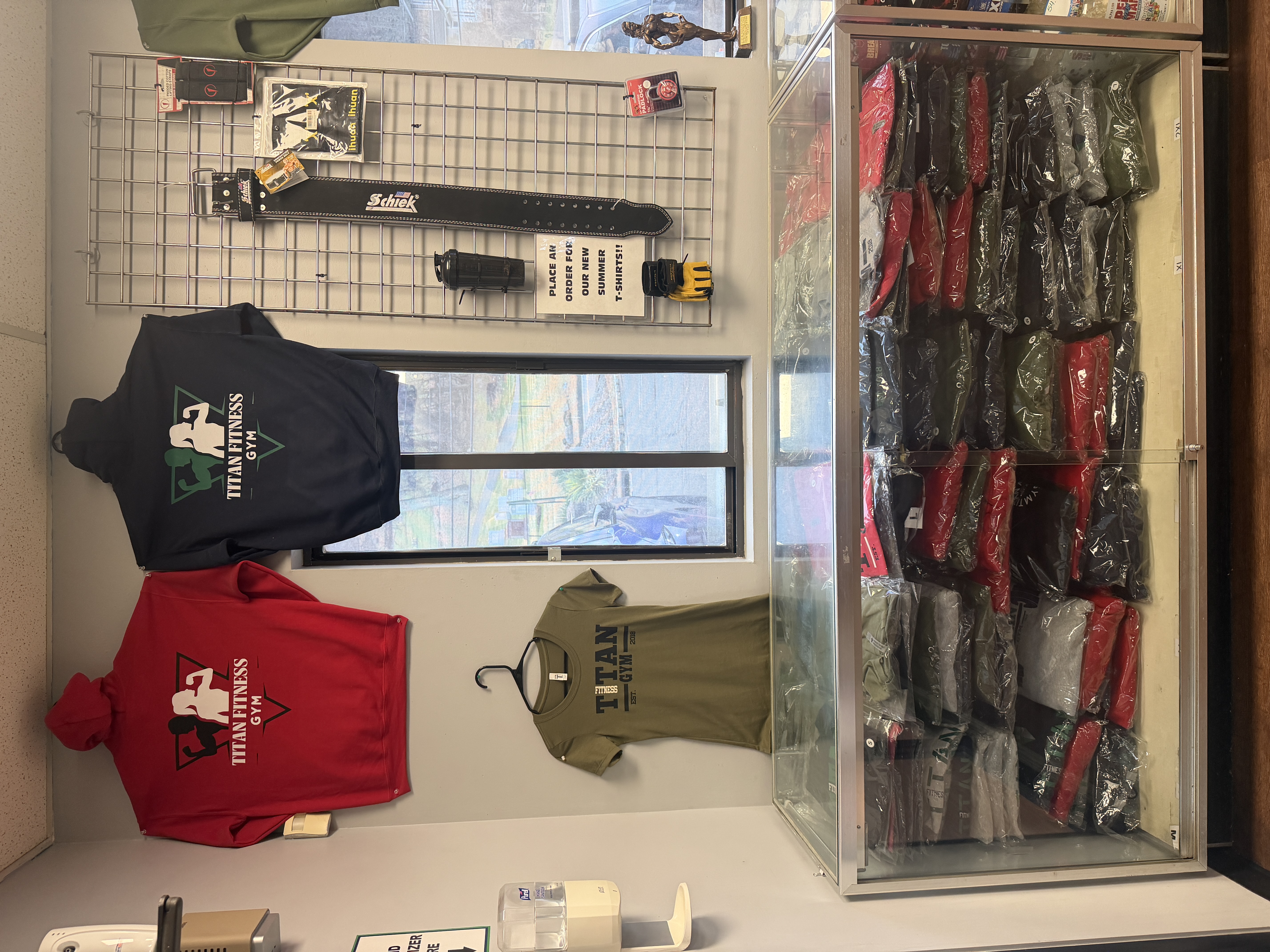 Titan Fitness apparel store with hoodies, t-shirts, and lifting gear