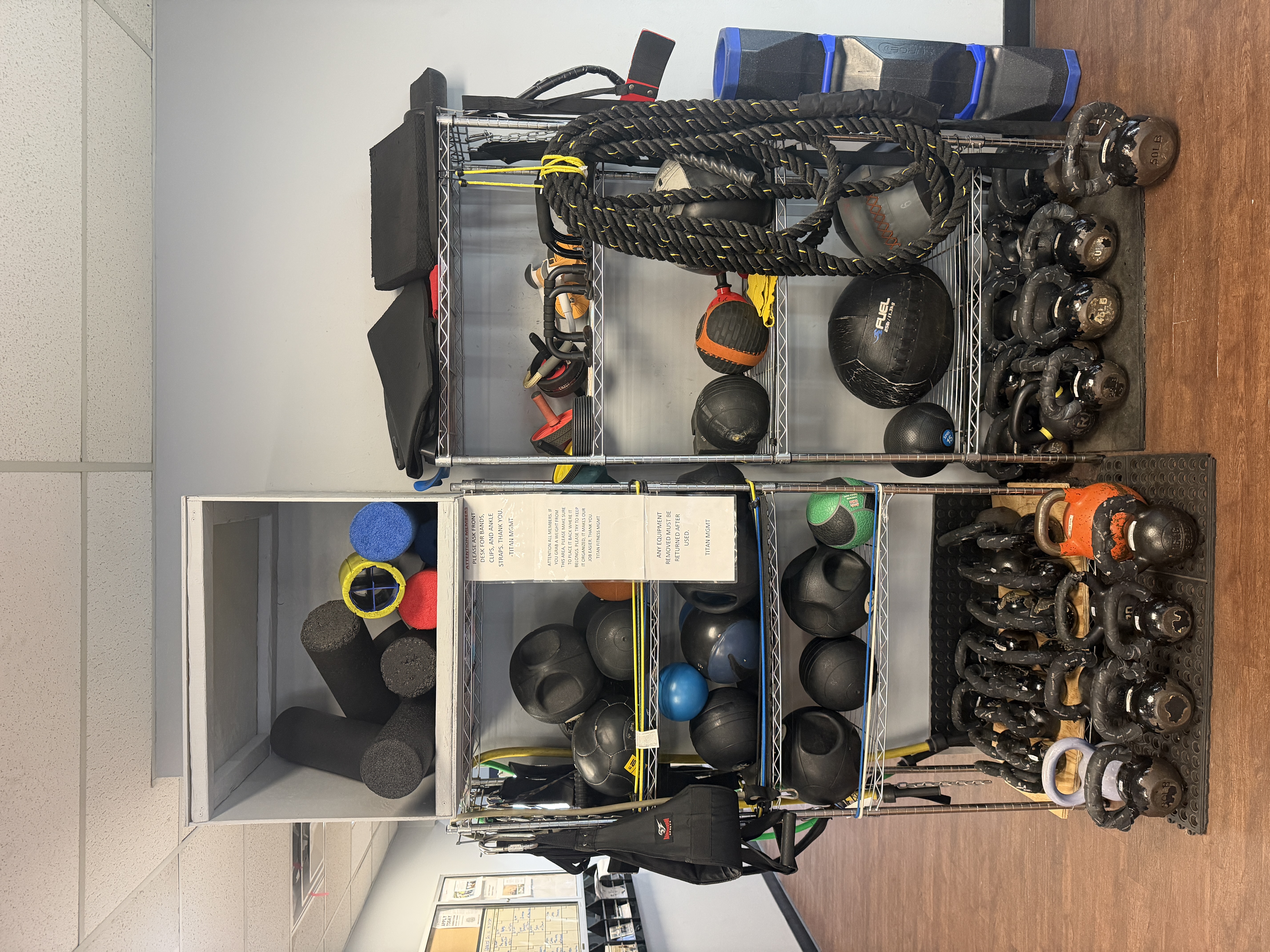 Kettlebells, battle ropes, medicine balls, and resistance bands at Titan Fitness