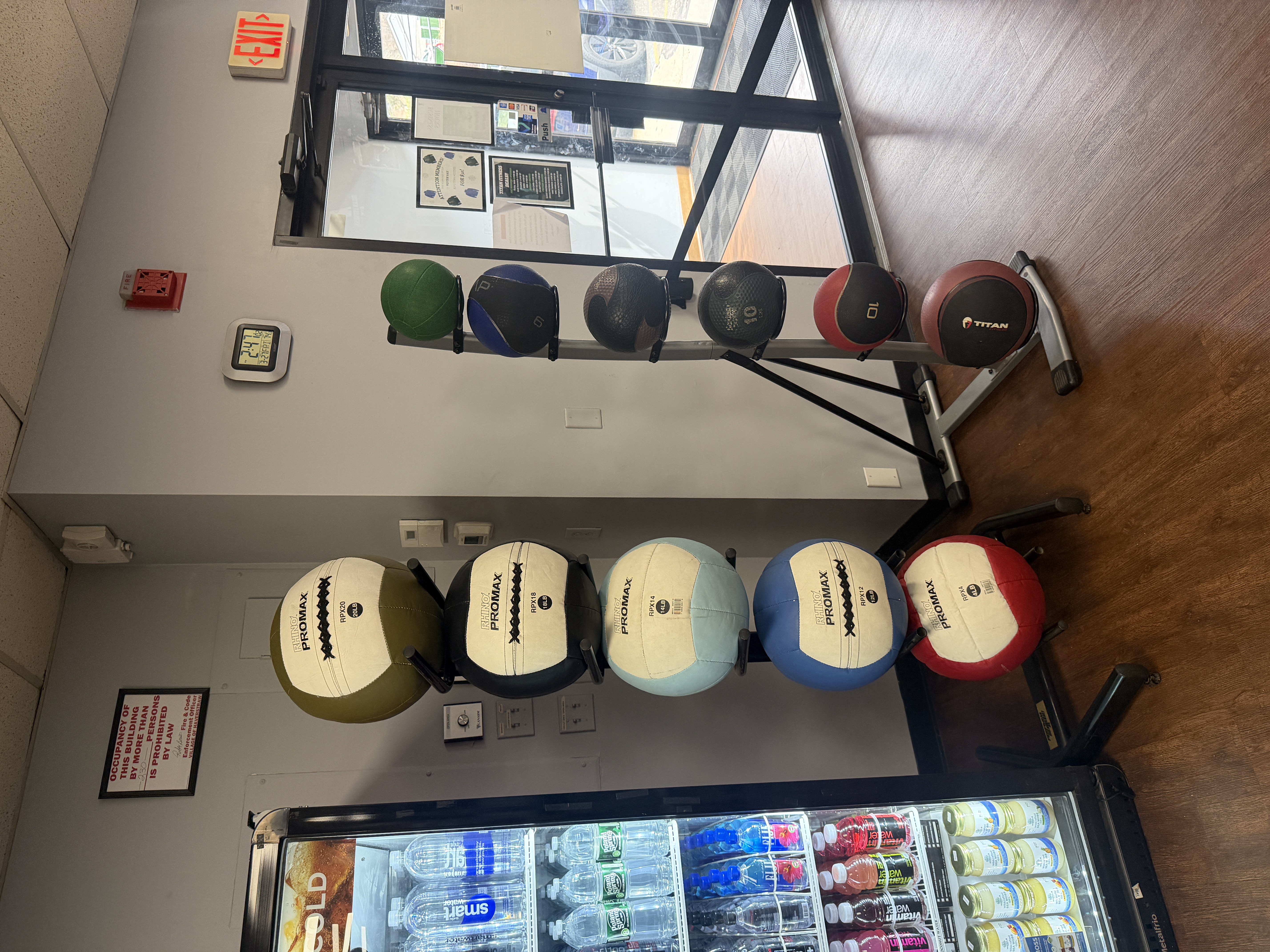 Promax wall balls and medicine ball rack at Titan Fitness